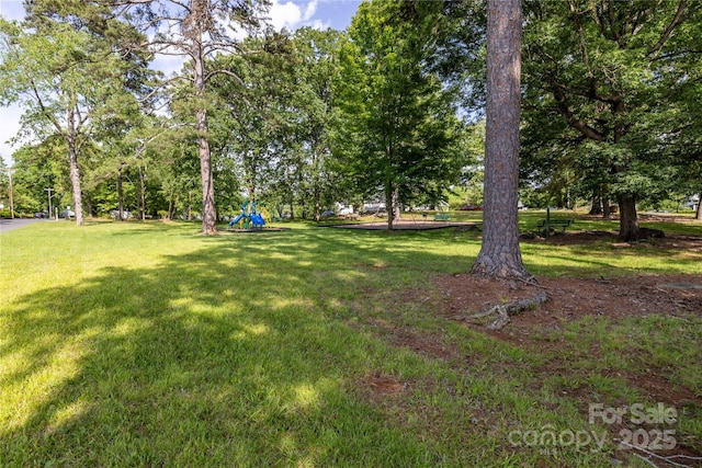80 Pine St, Badin, NC 28009 - view of grassy yard featuring view of wooded area