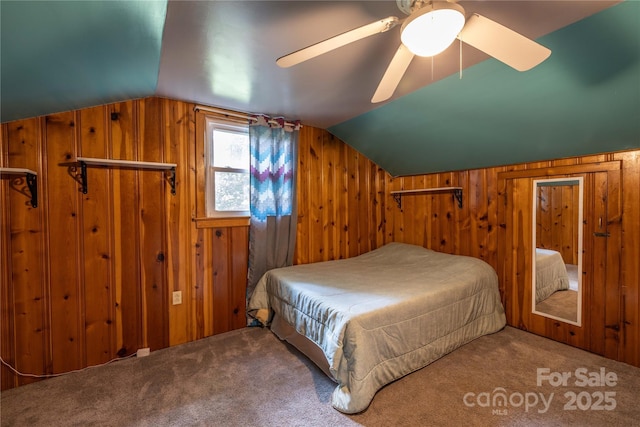 80 Pine St, Badin, NC 28009 - bedroom with wooden walls, lofted ceiling, carpet flooring, and ceiling fan