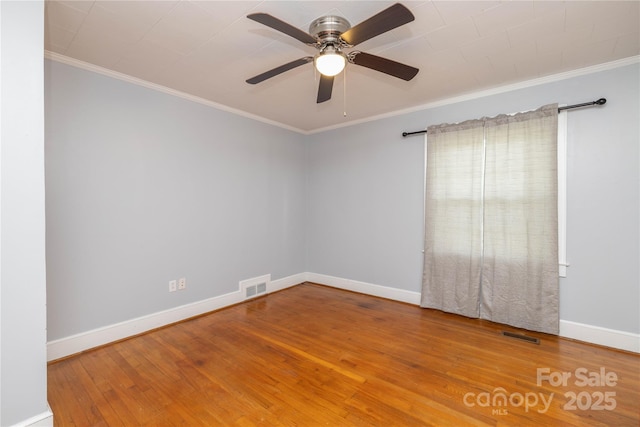 80 Pine St, Badin, NC 28009 - empty room with baseboards, ceiling fan, wood-type flooring, and ornamental molding
