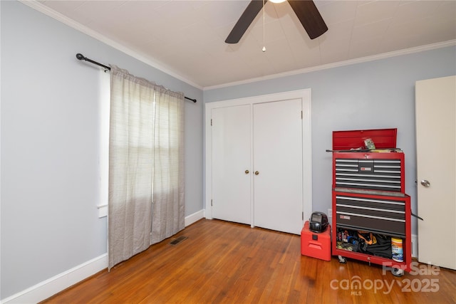 80 Pine St, Badin, NC 28009 - bedroom featuring wood finished floors, crown molding, a ceiling fan, baseboards, and a closet