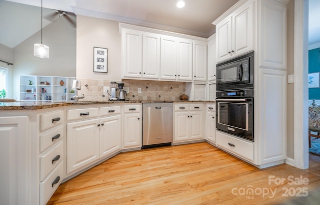 kitchen featuring black appliances, tasteful backsplash, white cabinets, dark stone countertops, and vaulted ceiling