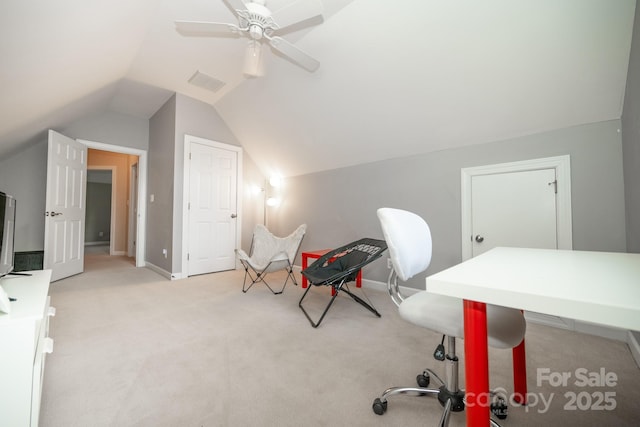 carpeted home office with vaulted ceiling, baseboards, and ceiling fan