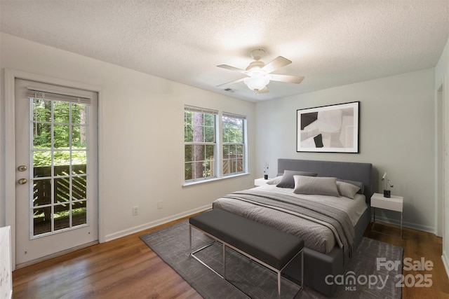 6016 Gray Gate Ln Unit C, Charlotte, NC 28210 - bedroom with a textured ceiling, wood finished floors, baseboards, and ceiling fan