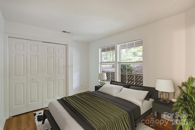 6016 Gray Gate Ln Unit C, Charlotte, NC 28210 - bedroom featuring a closet and wood finished floors