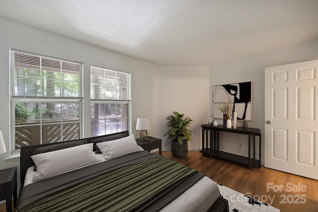 6016 Gray Gate Ln Unit C, Charlotte, NC 28210 - bedroom featuring wood finished floors and a textured ceiling