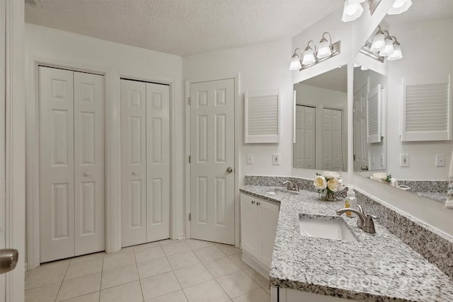 6016 Gray Gate Ln Unit C, Charlotte, NC 28210 - full bath with a closet, vanity, tile patterned floors, and a textured ceiling