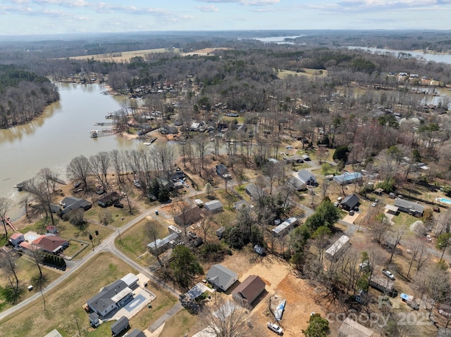 aerial view of property's location with a large body of water