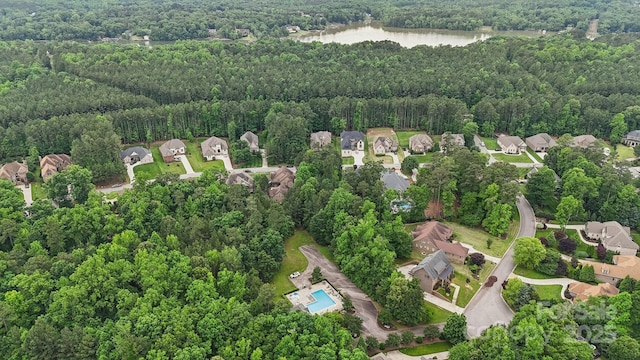 309 Palm Cove Way, York, SC 29745 - aerial overview of property's location featuring a heavily wooded area, a nearby body of water, and nearby suburban area