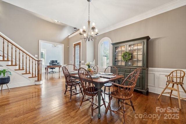 309 Palm Cove Way, York, SC 29745 - dining room featuring a chandelier, wood finished floors, stairway, and crown molding