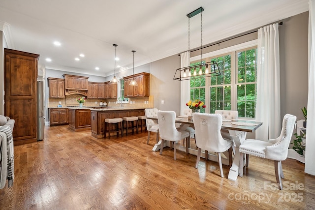 309 Palm Cove Way, York, SC 29745 - dining room featuring ornamental molding, light wood-style floors, a chandelier, and recessed lighting