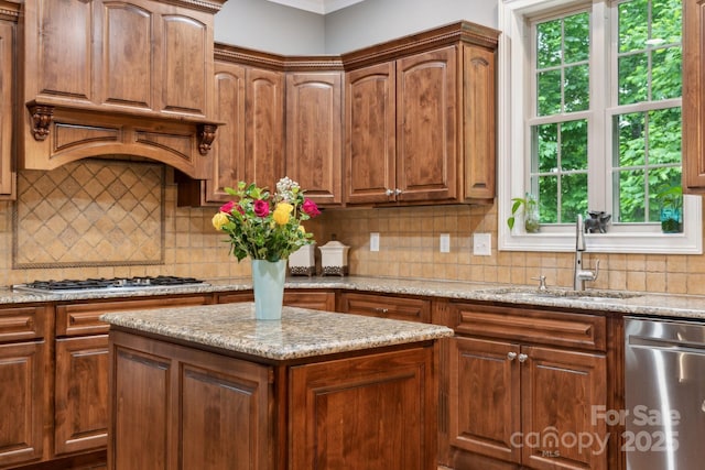 309 Palm Cove Way, York, SC 29745 - kitchen featuring appliances with stainless steel finishes, a sink, backsplash, and light stone countertops