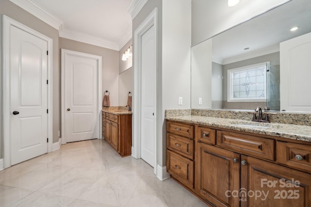309 Palm Cove Way, York, SC 29745 - full bathroom featuring crown molding, two vanities, and baseboards