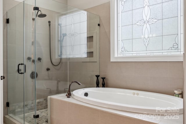 309 Palm Cove Way, York, SC 29745 - bathroom with a stall shower, a bath, and tile walls