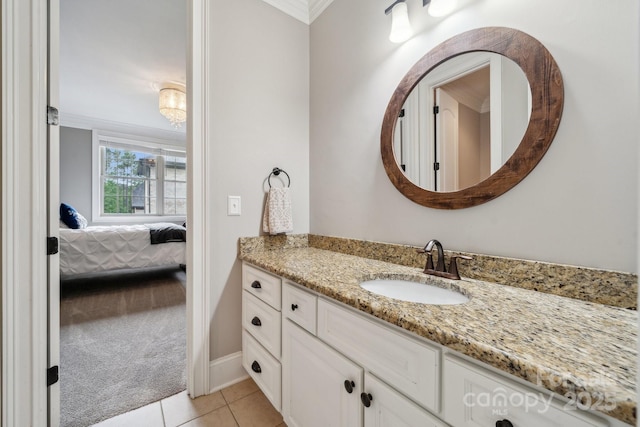 309 Palm Cove Way, York, SC 29745 - bathroom featuring tile patterned floors, vanity, ornamental molding, ensuite bathroom, and baseboards
