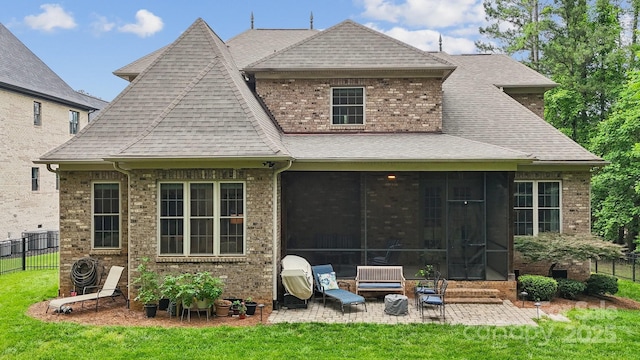 309 Palm Cove Way, York, SC 29745 - rear view of house with a shingled roof, brick siding, a patio area, a sunroom, and entry steps