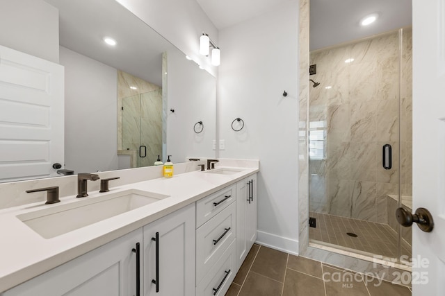 4011 Tundra Rd, Charlotte, NC 28203 - full bath featuring a shower stall, double vanity, baseboards, tile patterned floors, and recessed lighting
