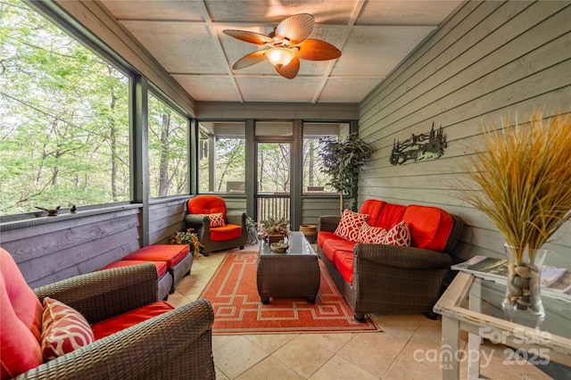 sunroom with an outdoor living space and ceiling fan