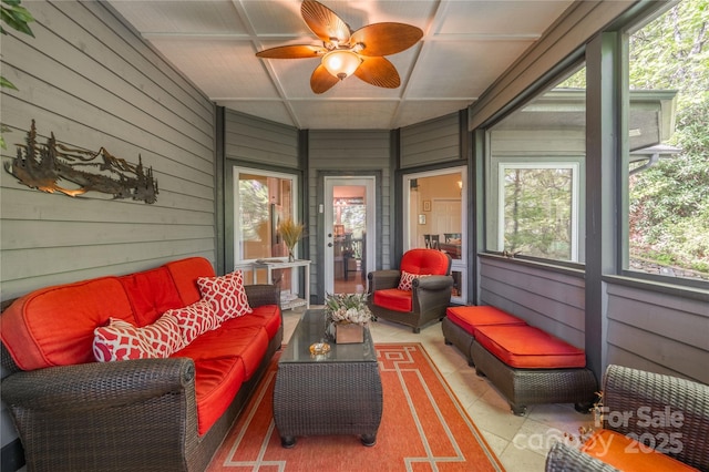 sunroom / solarium with outdoor lounge area and ceiling fan