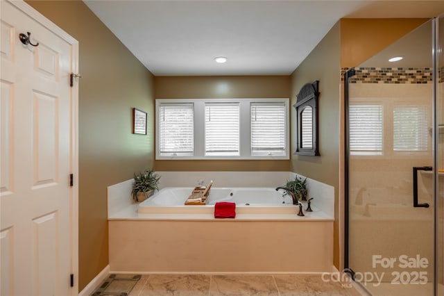 full bath featuring a shower stall, a bath, healthy amount of natural light, recessed lighting, and baseboards