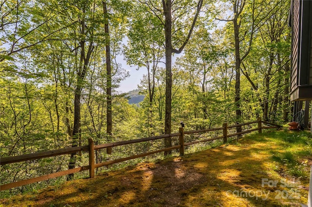 view of yard featuring a view of trees