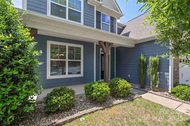 9230 Loch Glen Way, Charlotte, NC 28278 - view of exterior entry featuring a porch and a shingled roof