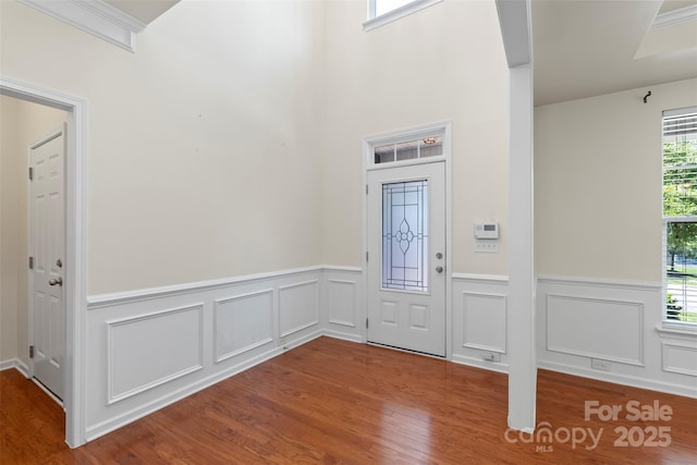 9230 Loch Glen Way, Charlotte, NC 28278 - entryway featuring plenty of natural light, wood finished floors, wainscoting, and a decorative wall