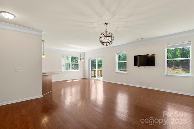 9230 Loch Glen Way, Charlotte, NC 28278 - unfurnished living room featuring crown molding, a chandelier, baseboards, and dark wood-style floors