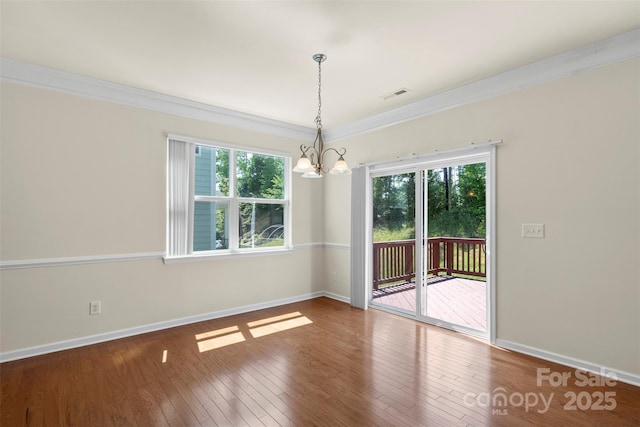 9230 Loch Glen Way, Charlotte, NC 28278 - unfurnished dining area with a chandelier, crown molding, healthy amount of natural light, and baseboards
