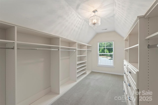 9230 Loch Glen Way, Charlotte, NC 28278 - walk in closet featuring light carpet, lofted ceiling, and a chandelier