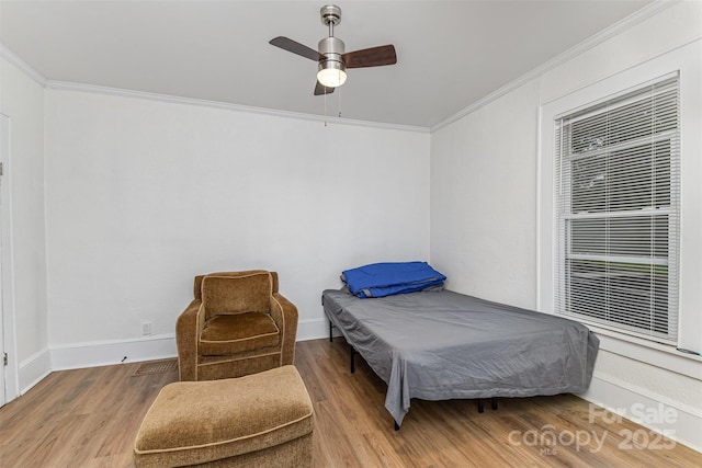 417 S Broad St, Gastonia, NC 28052 - bedroom featuring ornamental molding, wood finished floors, a ceiling fan, and baseboards