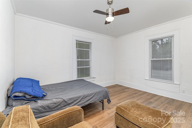 417 S Broad St, Gastonia, NC 28052 - bedroom with ornamental molding, wood finished floors, baseboards, and a ceiling fan
