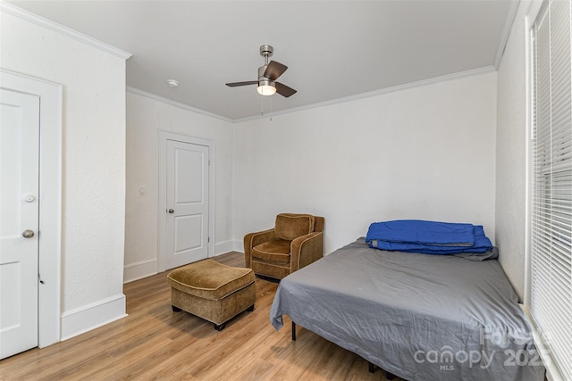 417 S Broad St, Gastonia, NC 28052 - bedroom featuring ornamental molding, light wood-style flooring, baseboards, and a ceiling fan