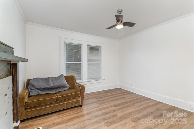 417 S Broad St, Gastonia, NC 28052 - sitting room featuring ornamental molding, light wood-style floors, a ceiling fan, and baseboards