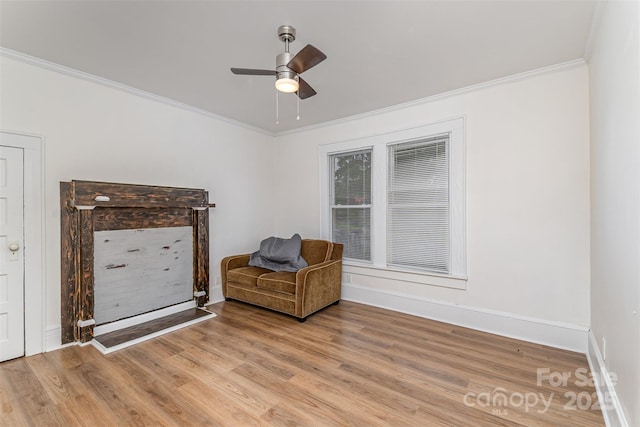 417 S Broad St, Gastonia, NC 28052 - living area with ornamental molding, light wood-style floors, a ceiling fan, and baseboards