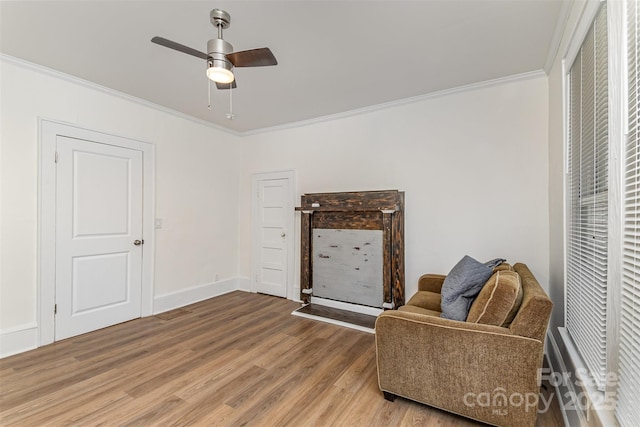 417 S Broad St, Gastonia, NC 28052 - sitting room with ornamental molding, light wood-style flooring, ceiling fan, and baseboards
