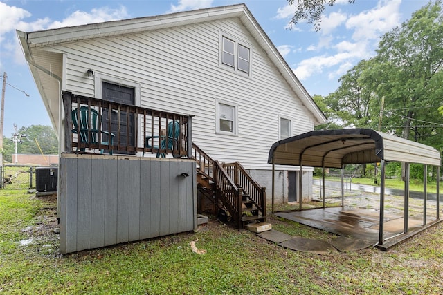 417 S Broad St, Gastonia, NC 28052 - rear view of house featuring stairs, a carport, central air condition unit, and a wooden deck