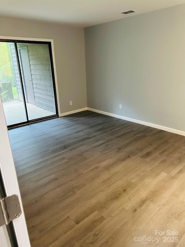 8029 Cedar Glen Dr, Charlotte, NC 28212 - empty room with wood finished floors and baseboards