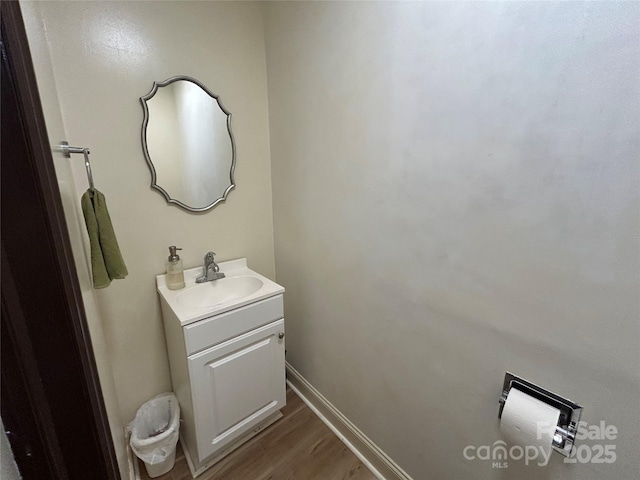 2009 Hickory Grove Rd, Gastonia, NC 28056 - bathroom with vanity, wood finished floors, and baseboards