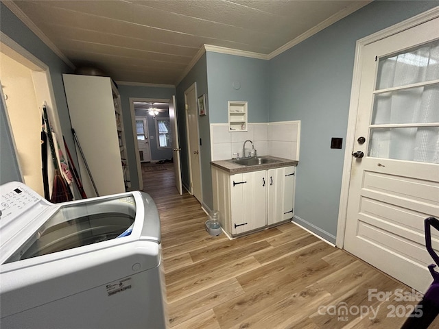 2009 Hickory Grove Rd, Gastonia, NC 28056 - laundry room featuring washer / clothes dryer, cabinet space, ornamental molding, light wood-type flooring, and a ceiling fan
