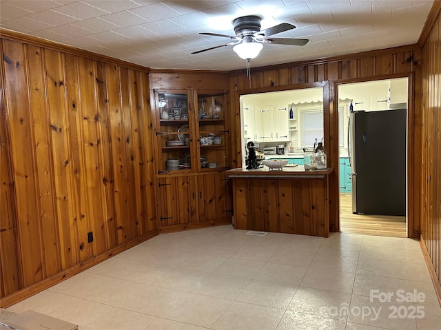 2009 Hickory Grove Rd, Gastonia, NC 28056 - kitchen with freestanding refrigerator, wooden walls, a ceiling fan, crown molding, and open shelves