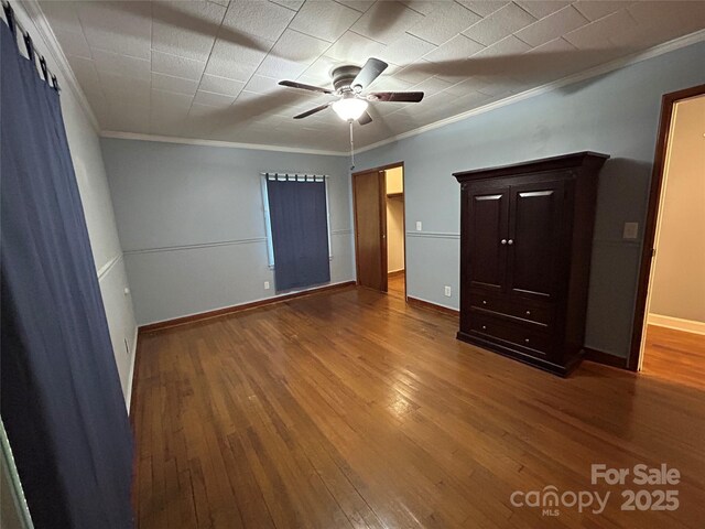 2009 Hickory Grove Rd, Gastonia, NC 28056 - unfurnished bedroom with crown molding, hardwood / wood-style flooring, baseboards, and a ceiling fan
