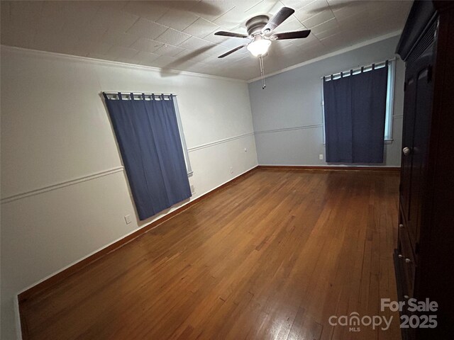 2009 Hickory Grove Rd, Gastonia, NC 28056 - spare room with ornamental molding, a ceiling fan, wood-type flooring, and baseboards