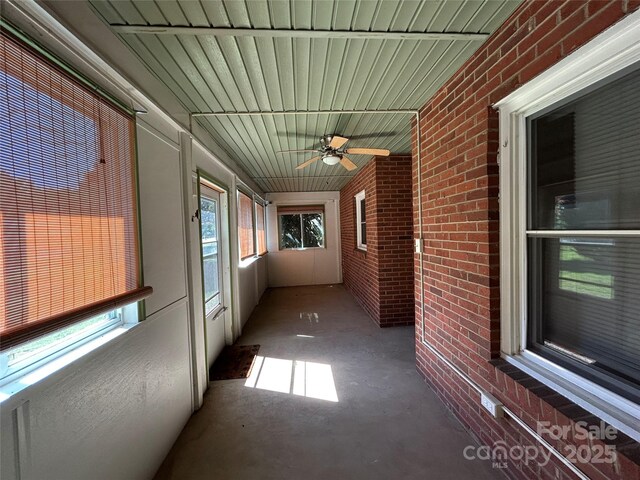 2009 Hickory Grove Rd, Gastonia, NC 28056 - unfurnished sunroom with a ceiling fan
