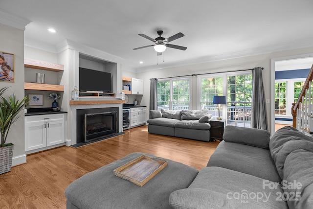 327 Wilby Dr, Charlotte, NC 28270 - living area featuring ornamental molding, a fireplace with flush hearth, ceiling fan, light wood-type flooring, and recessed lighting