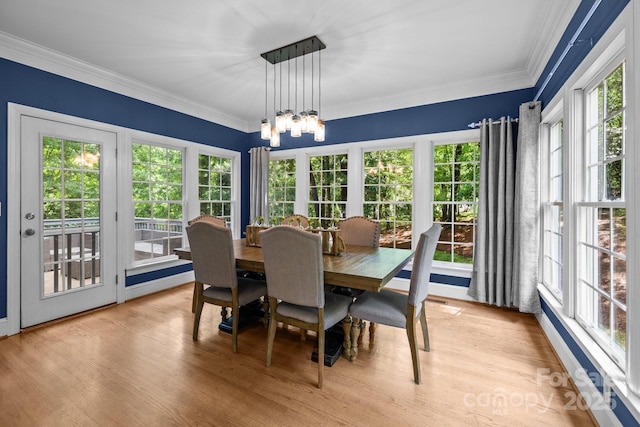 327 Wilby Dr, Charlotte, NC 28270 - dining room with a chandelier, light wood-type flooring, and crown molding