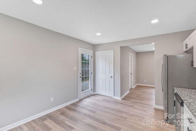 2511 Linwood Rd, Gastonia, NC 28052 - kitchen with white cabinetry, light wood finished floors, baseboards, light stone countertops, and recessed lighting