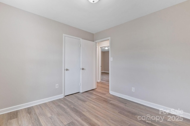 2511 Linwood Rd, Gastonia, NC 28052 - unfurnished bedroom featuring wood finished floors and baseboards