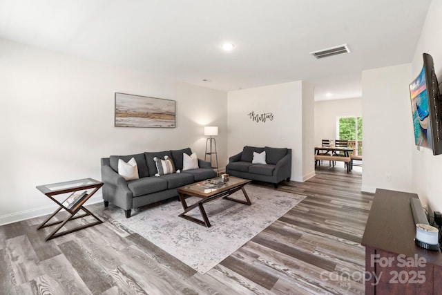 7308 Rothmore St, Charlotte, NC 28215 - living room with dark wood-type flooring, baseboards, and recessed lighting