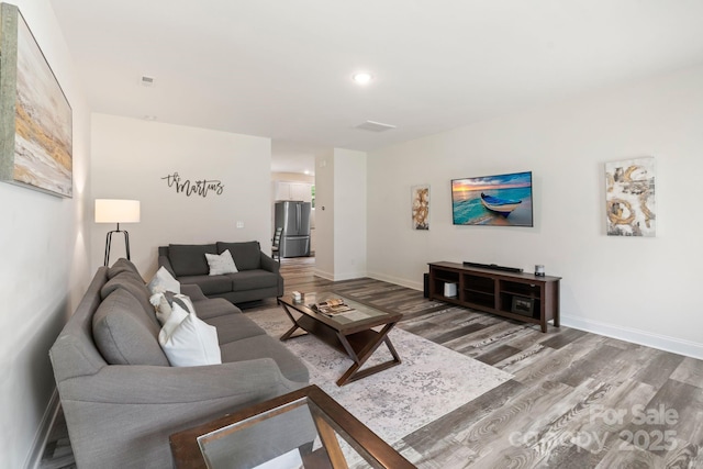 7308 Rothmore St, Charlotte, NC 28215 - living area with light wood-style flooring, baseboards, and recessed lighting
