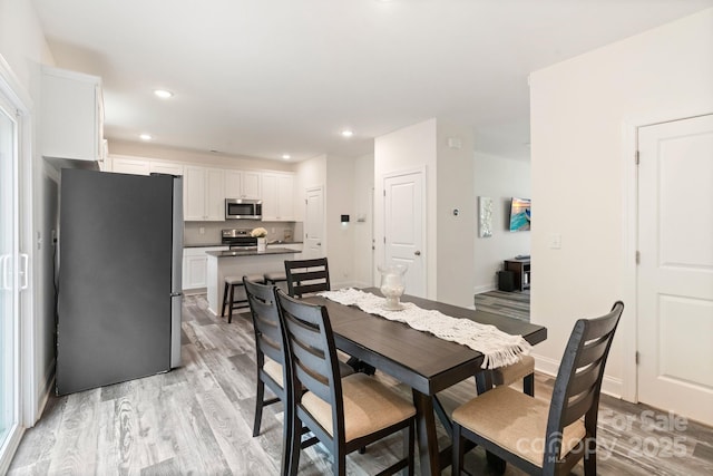 7308 Rothmore St, Charlotte, NC 28215 - dining space with light wood-type flooring and recessed lighting
